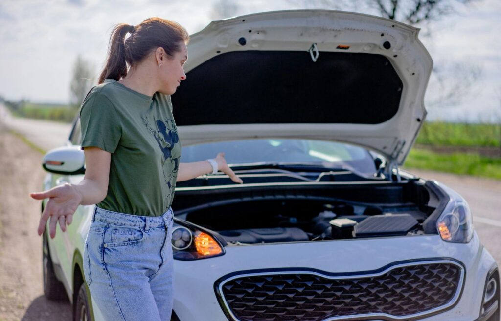 A Woman Standing by a Car