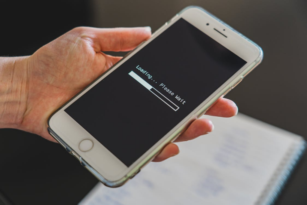 Phone stuck loading with data throttling explained for users comparing mobile plan speeds.