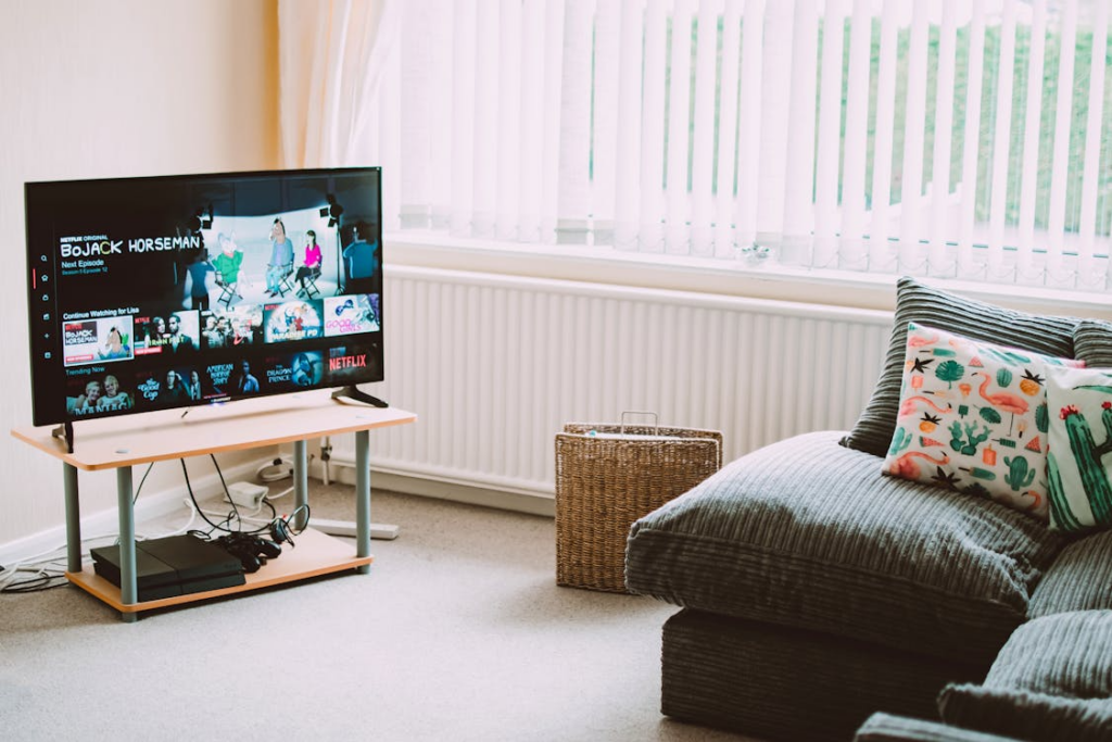 Living room with one of the best budget TVs for streaming showing Netflix and other apps on screen.