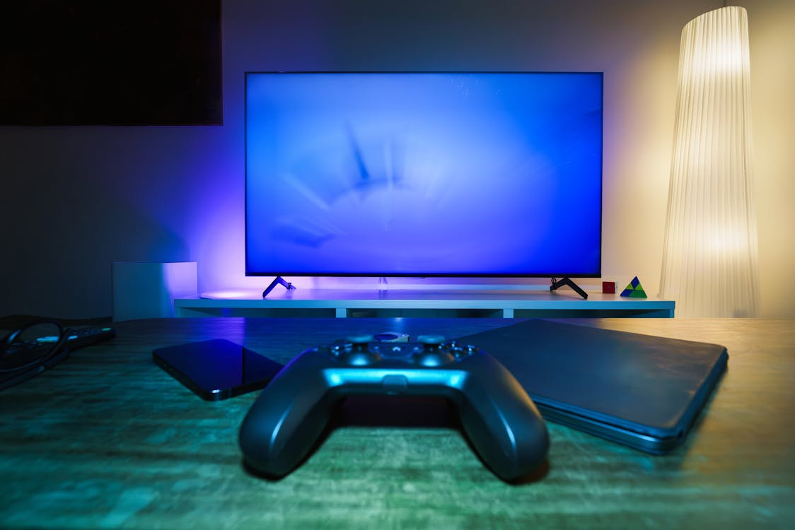 Gaming consoles vs streaming devices setup with a TV, controller, and media devices.